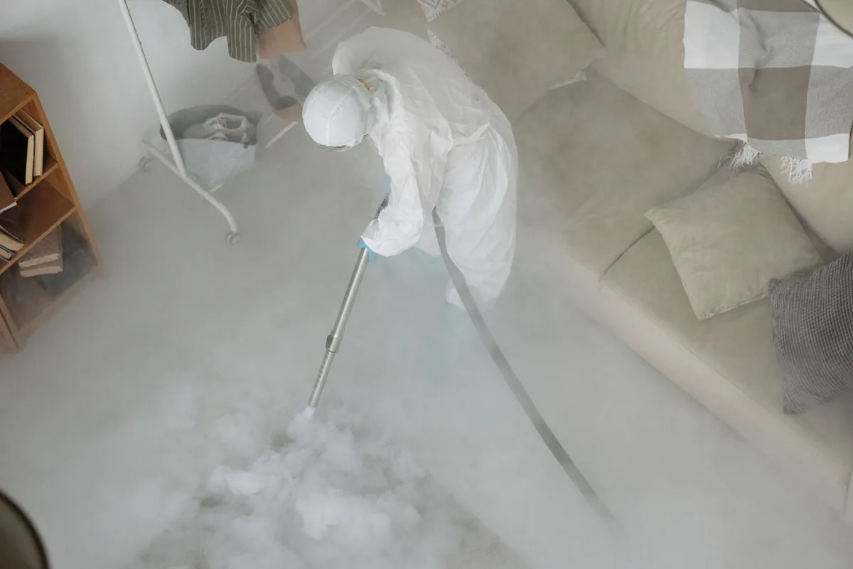Biohazard cleanup technician in protective equipment, Kronenwetter, WI